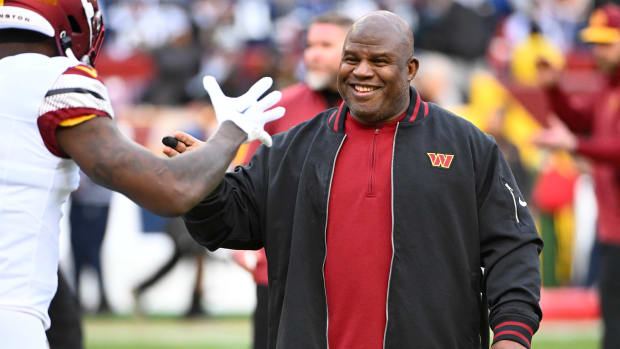 Washington Commanders offensive coordinator Eric Bieniemy on the field before the game against the Dallas Cowboys at FedExField